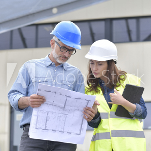 workers looking at plan