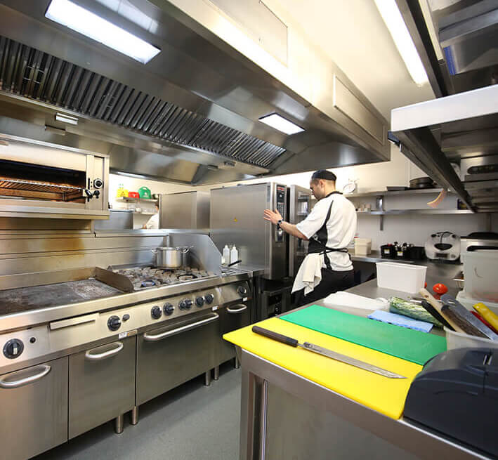 Acme Finance chef in commercial kitchen