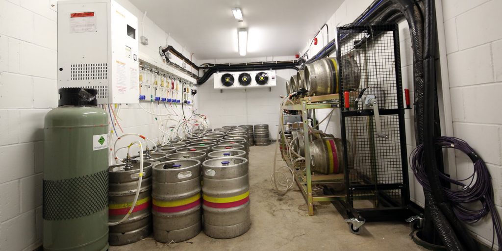 Cellar with kegs, stills and conditioning unit